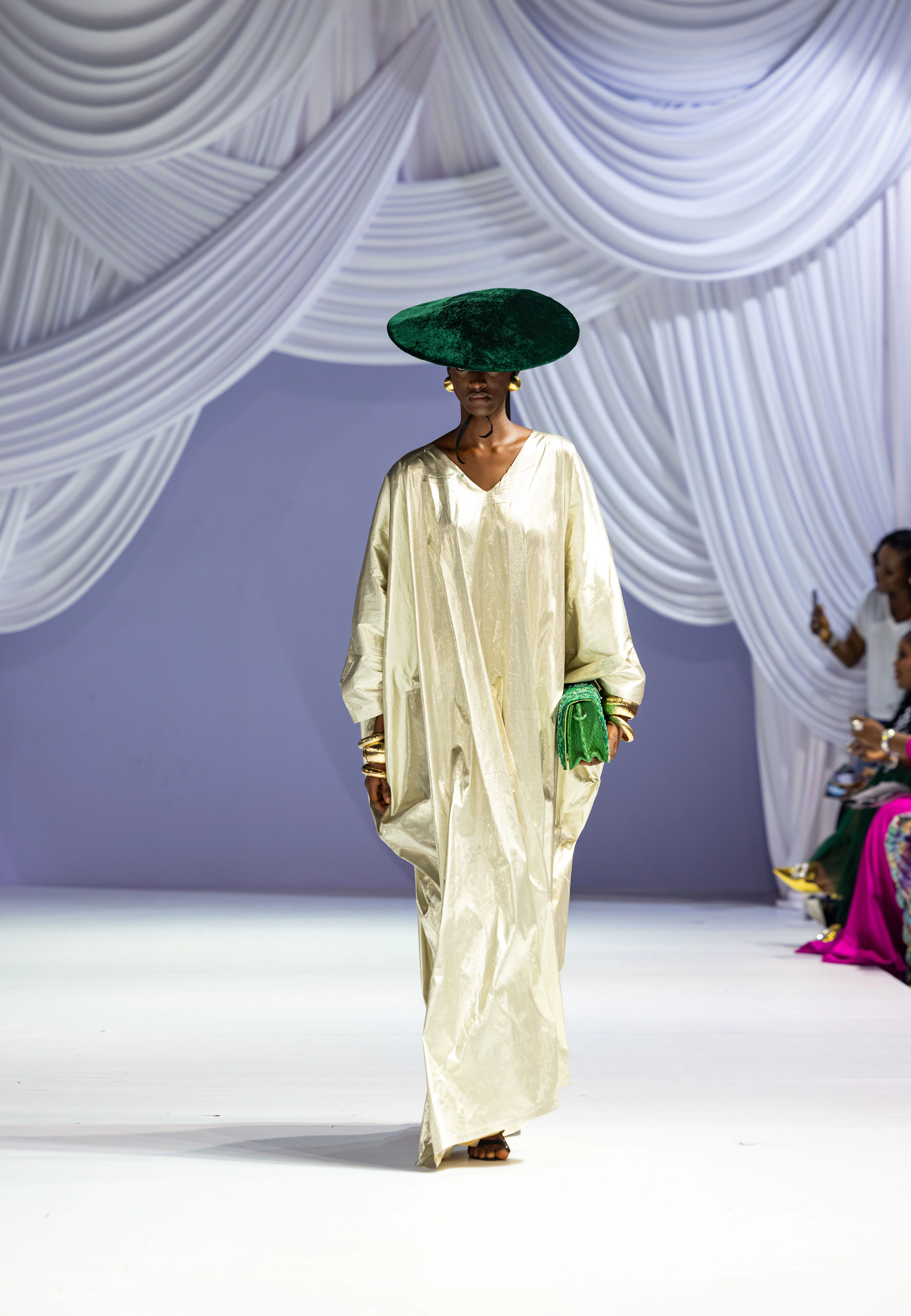 Sculptural ivory dress and green velvet hat