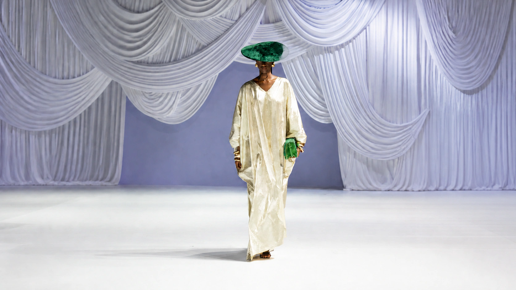 Lanre Da Silva ivory runway look with emerald hat